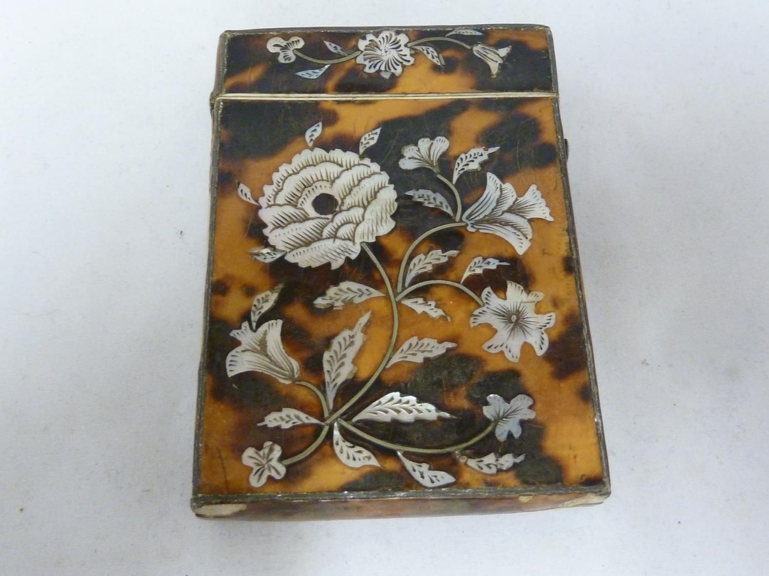 A Victorian tortoiseshell visiting card case, inlaid with a peony spray and leaves in nacreous