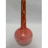 A Bohemian glass bottle vase, of graduated rose pink over white, gilded with prunus flowers and a