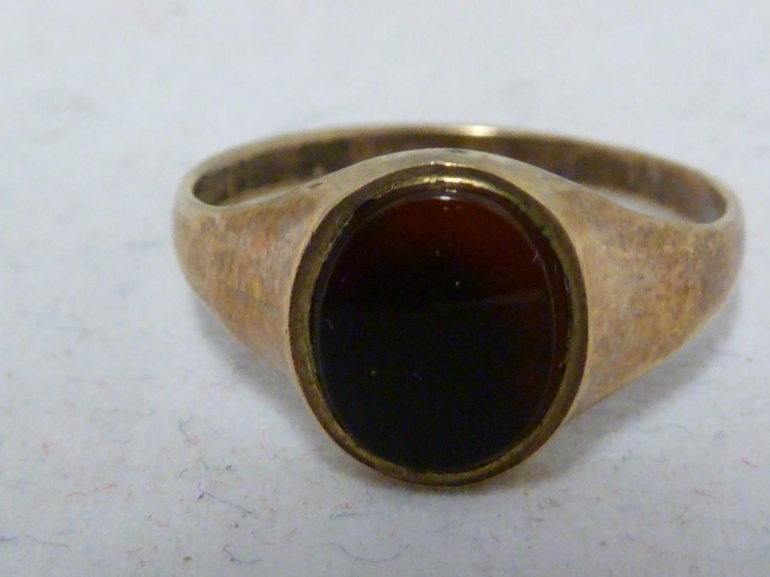 Two yellow gold signet rings, one marked 9ct and set with an oval black stone, ring size L 1/2, - Image 2 of 7