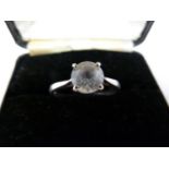A 18ct white gold solitaire ring, set with a white stone, stamped 750 with hallmarks, ring size R, 3