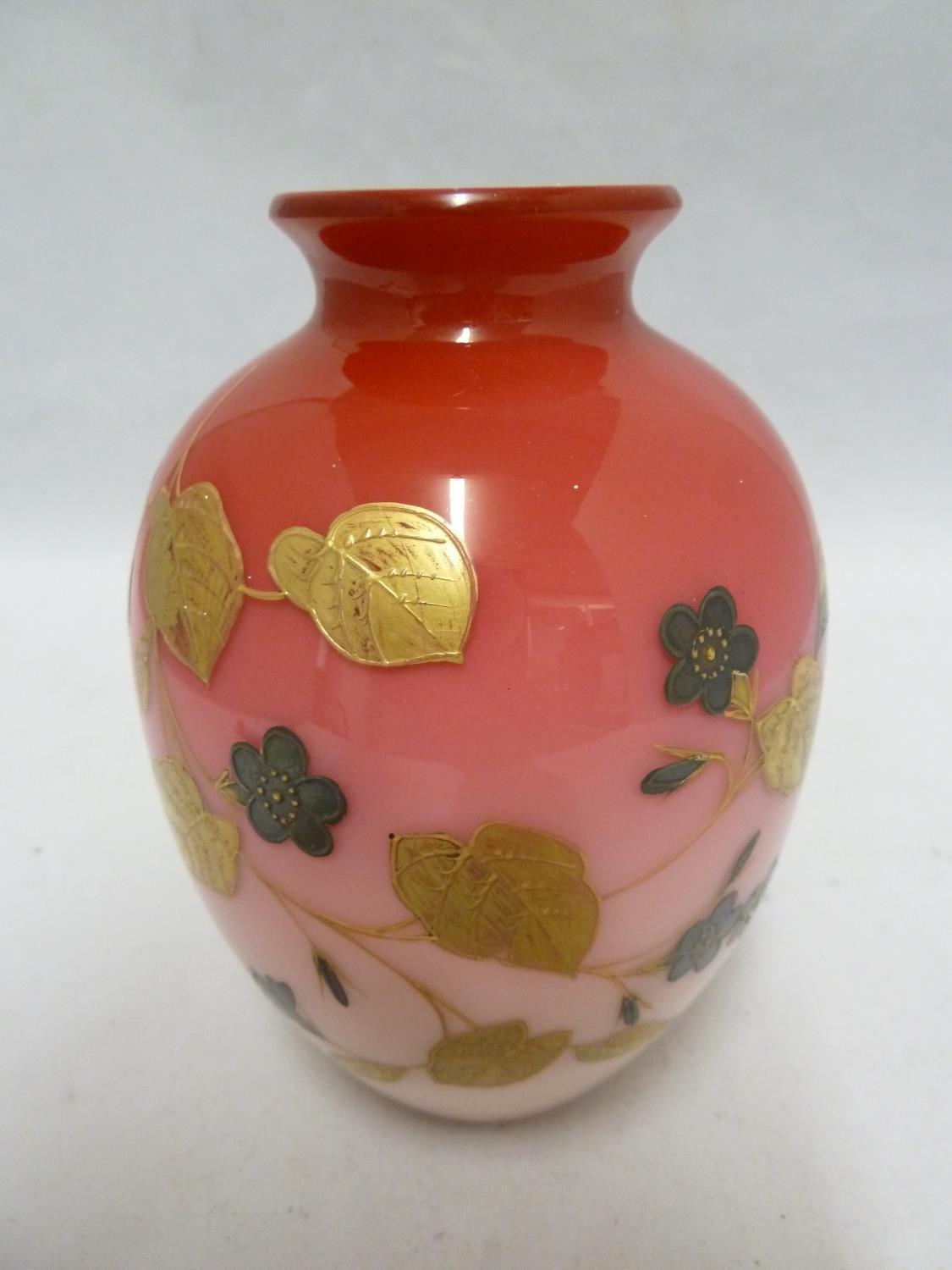 A Bohemian glass vase, of cased graduated rose pink glass over a white body, decorated with