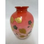 A Bohemian glass vase, of cased graduated rose pink glass over a white body, decorated with