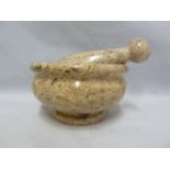 A shelly limestone mortar and pestle, probably from the Dorset region, the stone polished to