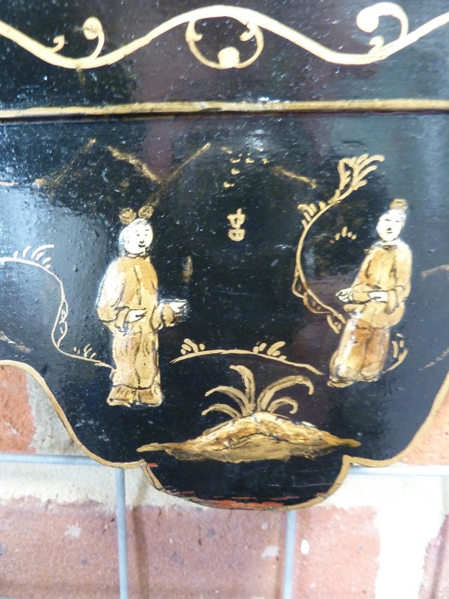A Chinoiserie black japanned framed looking glass, decorated with gilded raised figures in a - Image 4 of 7