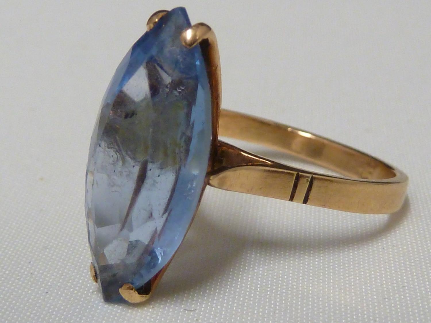 An aquamarine set ring, set in pierced yellow metal, stamped with Arabic marks; a marquise ring - Image 9 of 13