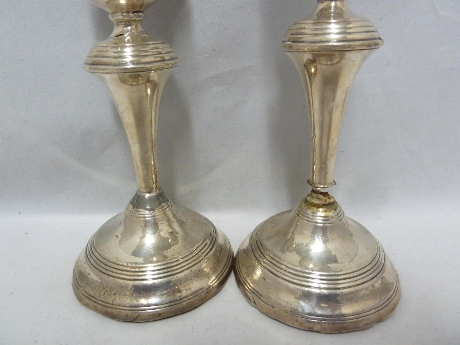 A pair of silver candlesticks, with reeded rims, Birmingham 1955, makers mark B&Co for Broadway & - Image 3 of 9