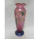 Okra - a glass vase, of pink bullet shaped body with frilled rim and circular blue glass foot, the
