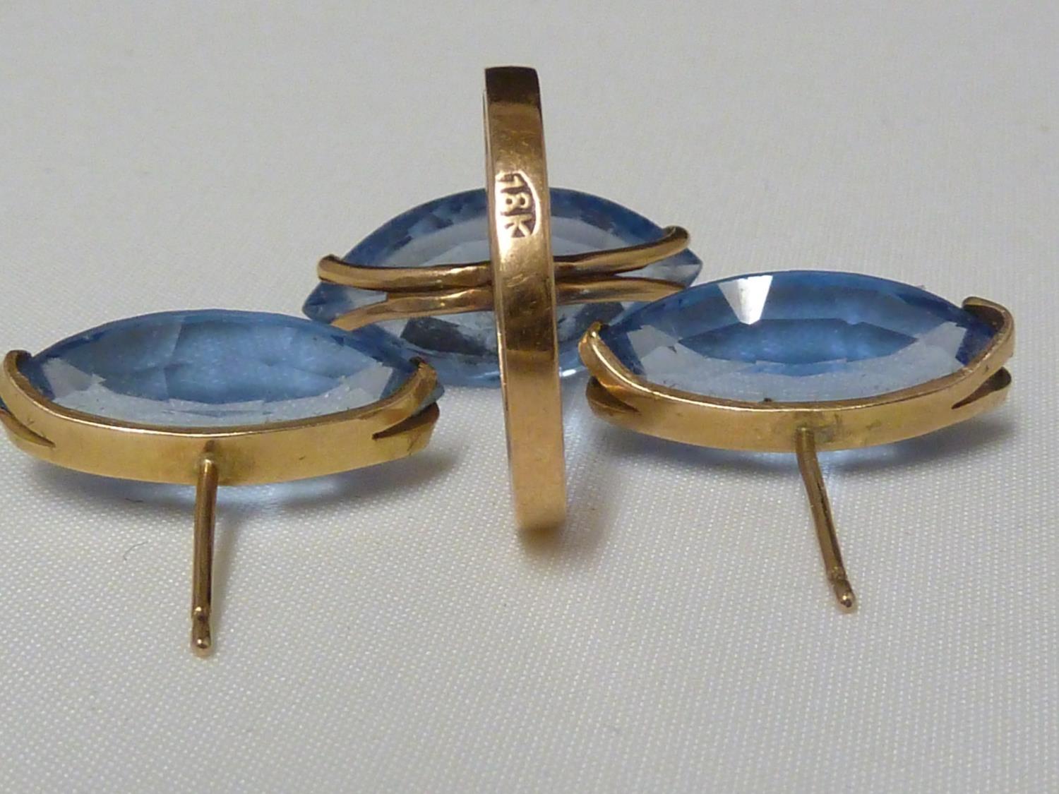 An aquamarine set ring, set in pierced yellow metal, stamped with Arabic marks; a marquise ring - Image 13 of 13
