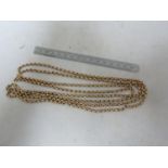 A yellow metal muff chain, stamped 375 to clasp, belcher type link, 160cm approx, 49 grms approx