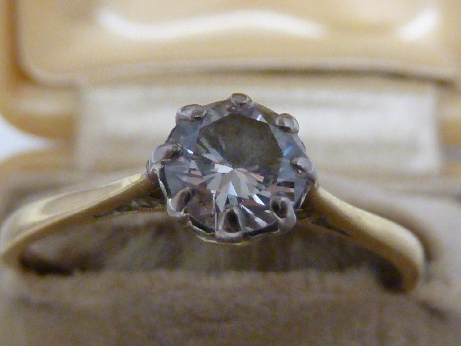 A solitaire diamond ring, the single round diamond of approx 0.5 carat set in an unmarked yellow - Image 3 of 9
