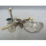 Four silver items, comprising an enamell an silver topped scent cut glass bottle; a pierced ring