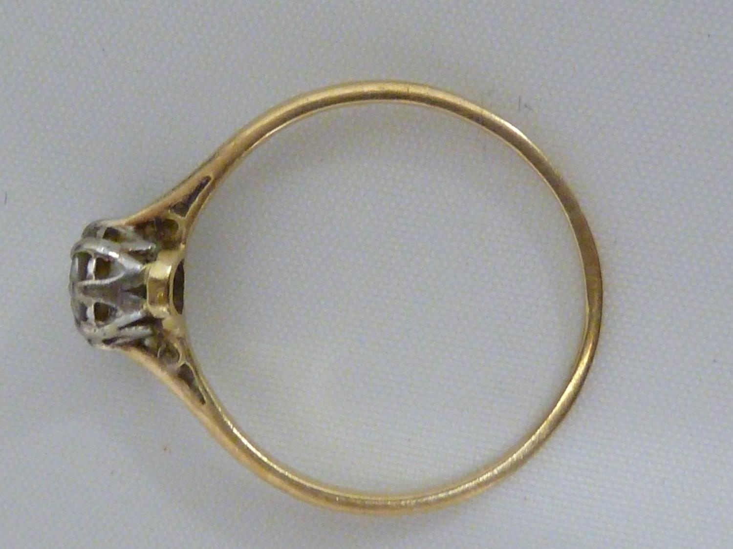 A solitaire diamond ring, the single round diamond of approx 0.5 carat set in an unmarked yellow - Image 6 of 9