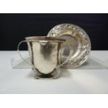 An Arts and Crafts silver egg cup, the plannished body applied with three barbed handles forming a