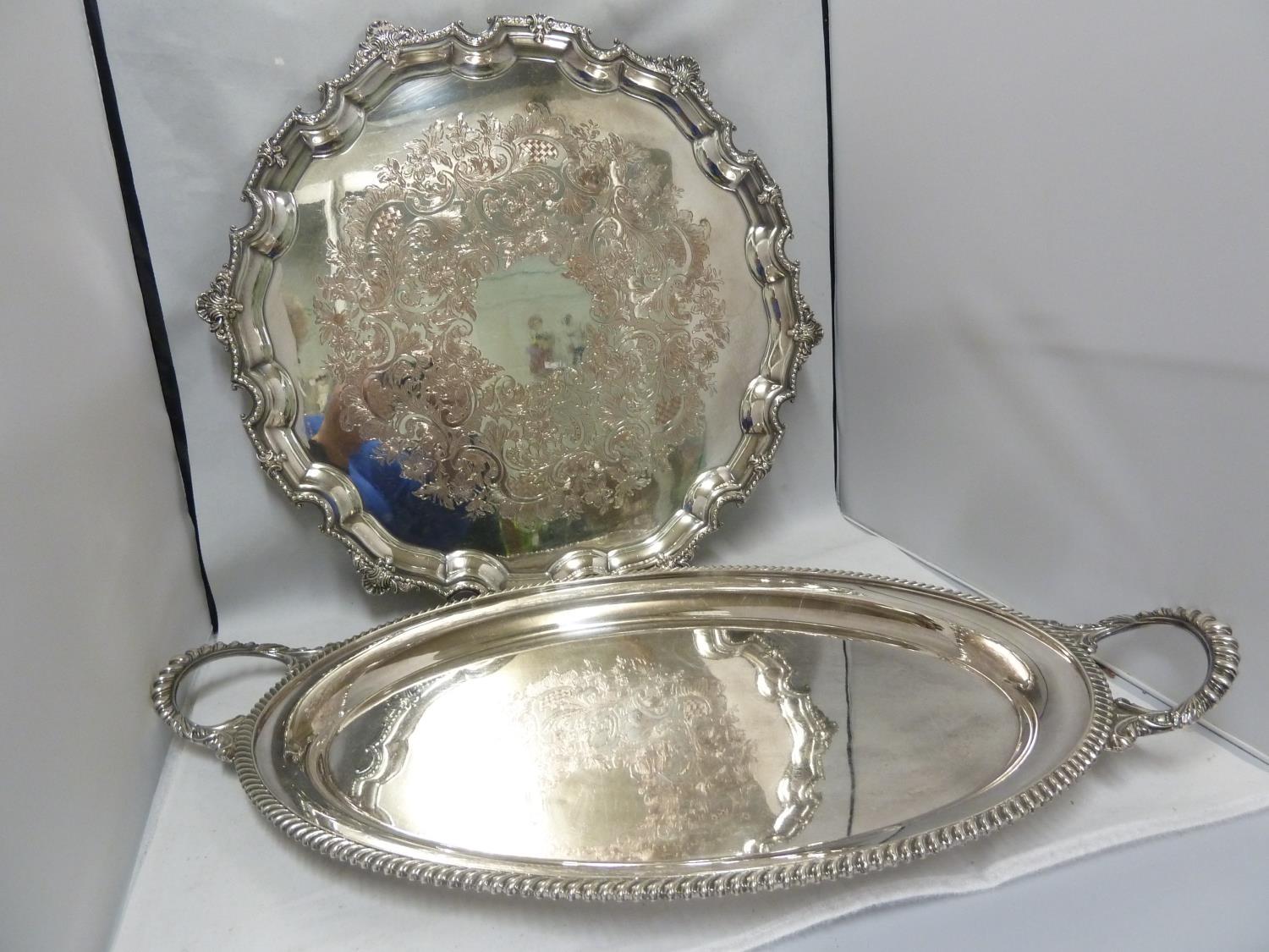 A large silver plated two handled tray, of oval shape, 58cm max diam approx; and one large