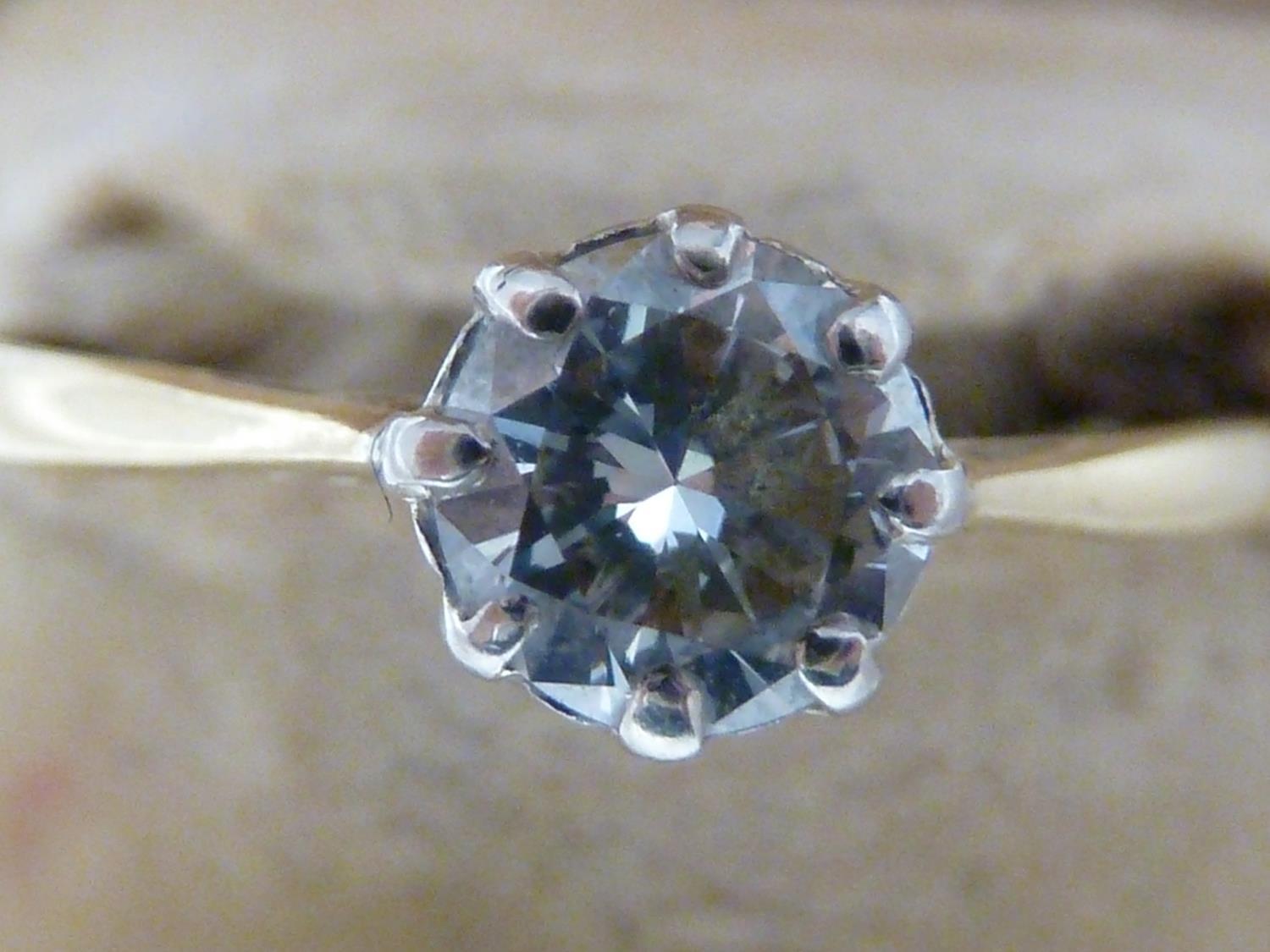 A solitaire diamond ring, the single round diamond of approx 0.5 carat set in an unmarked yellow - Image 4 of 9