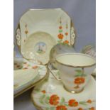 Paragon - Two Hedgeside Flower pattern cups and saucers, the cups with primrose flower handles;