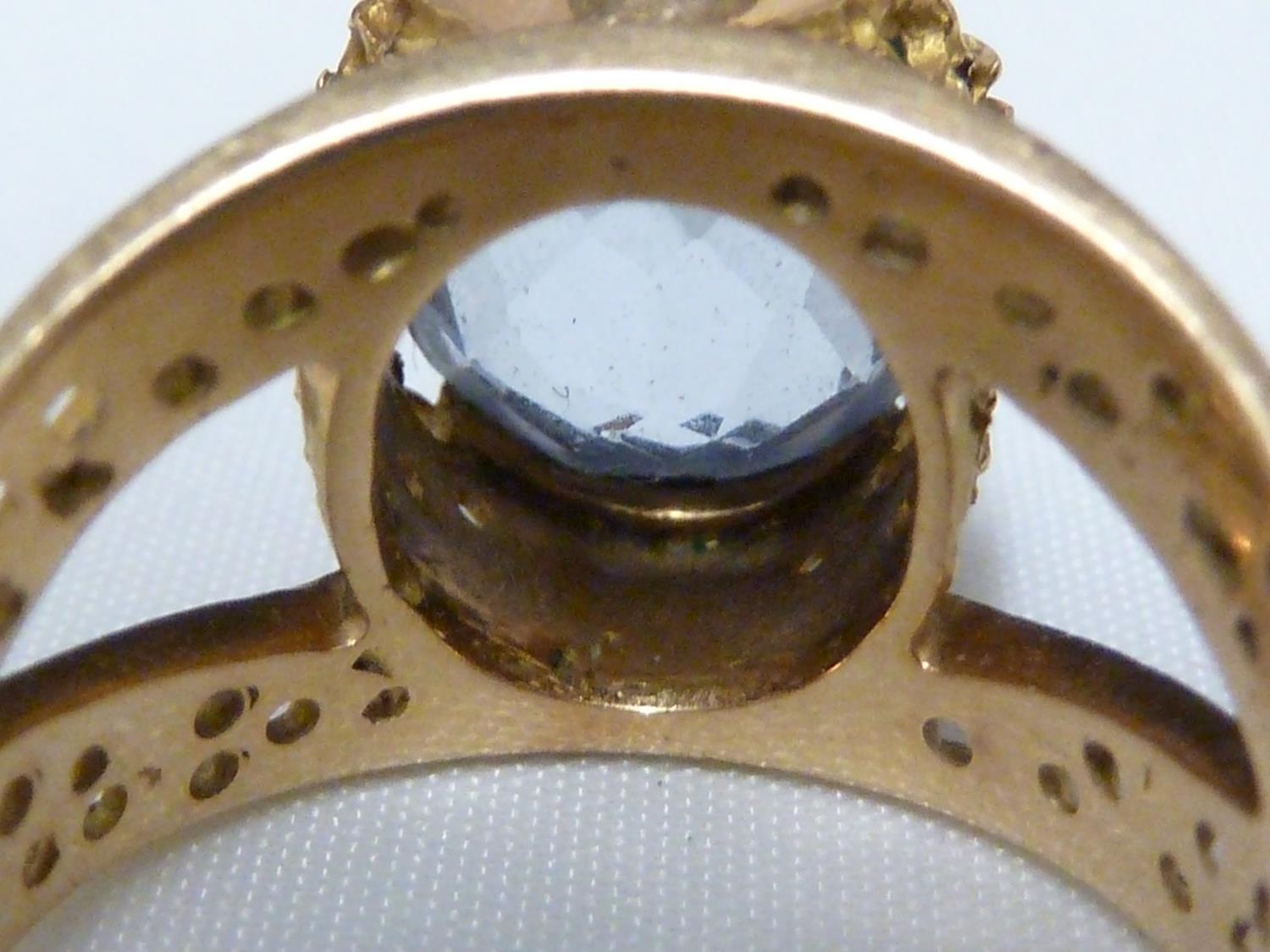 An aquamarine set ring, set in pierced yellow metal, stamped with Arabic marks; a marquise ring - Image 4 of 13