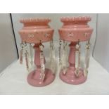 Bohemian - a pair of rose pink glass table lustres, the bowls enamelled with flower sprays and set