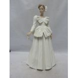 Nao - a porcelain figure of a bride, a handkerchief in one hand, 29cm high; together with the