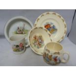 Bunnykins, Royal Doulton - Nursery ware, comprising, mug, bowl and plate; a Grimwades Peter Rabbit
