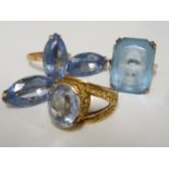 An aquamarine set ring, set in pierced yellow metal, stamped with Arabic marks; a marquise ring