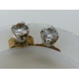 A pair of 0.1 carat diamond studs, set in white metal, 0.9grms (2)