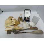 Ladies Vintage Accesories - a German porcelain pin-cushion dolls; two silver mounted shoe horns; a