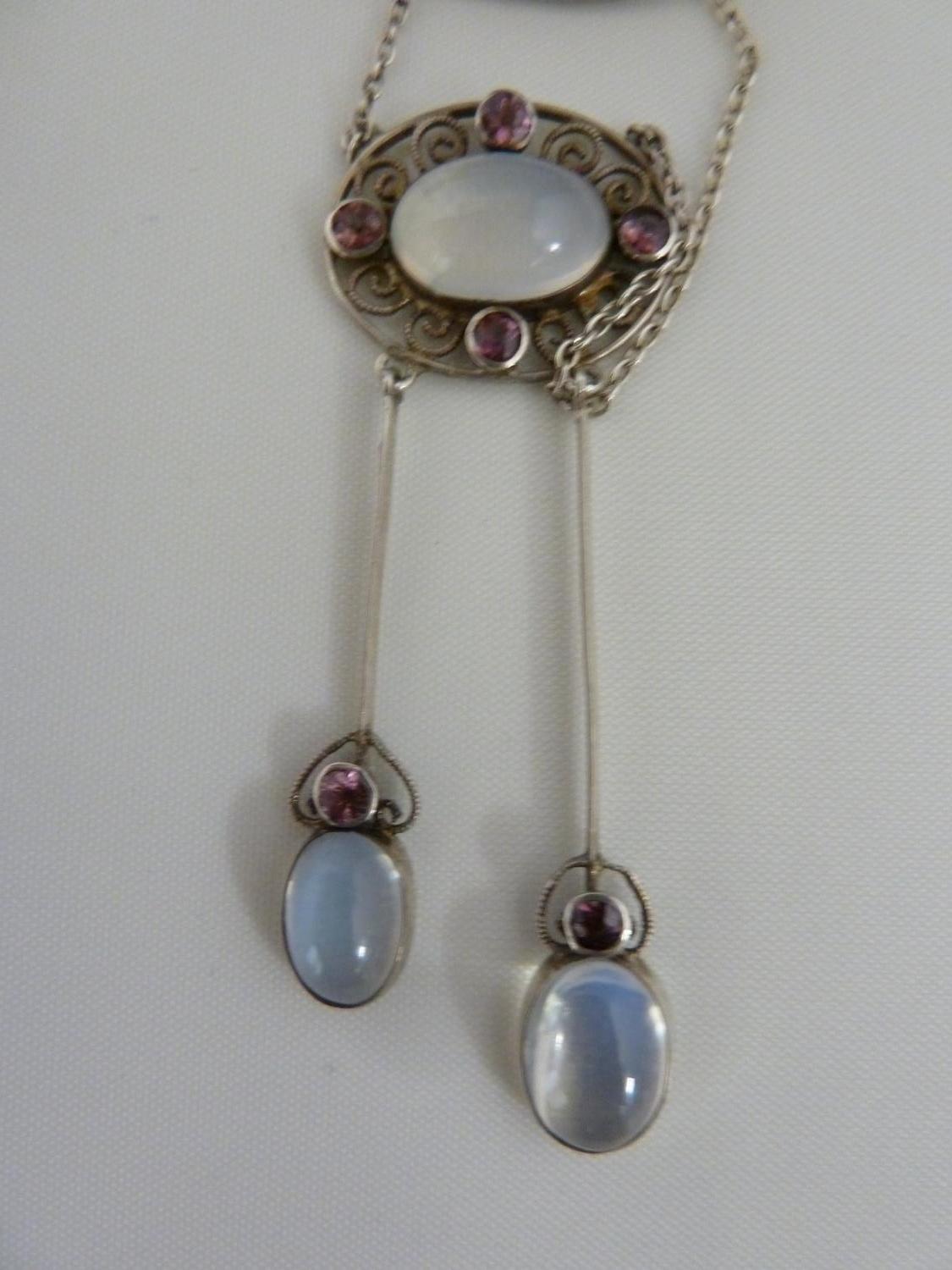 A Belle Epoque pendant and brooch set, the white metal filigree work supporting oval moonstones - Image 5 of 7