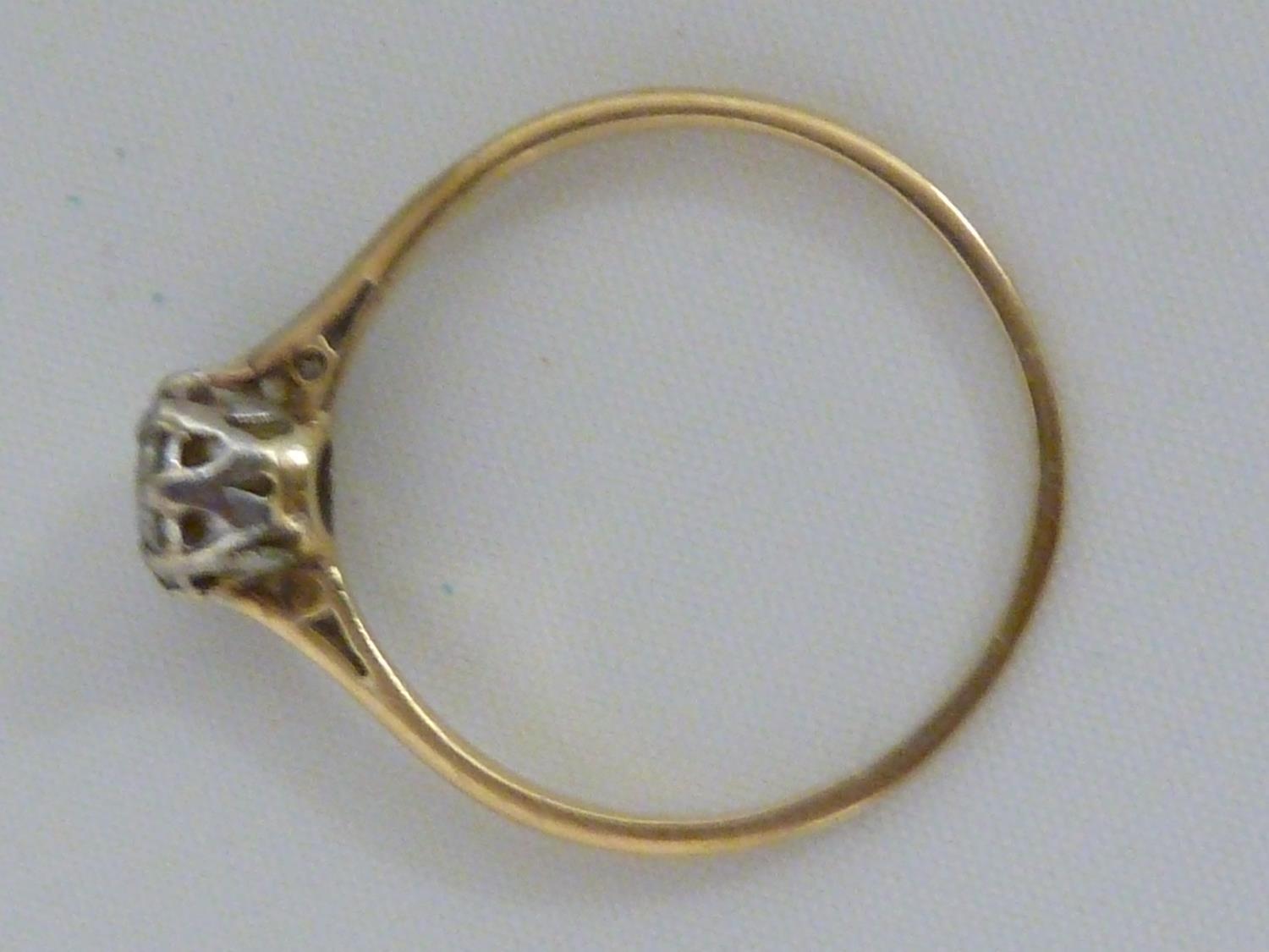 A solitaire diamond ring, the single round diamond of approx 0.5 carat set in an unmarked yellow - Image 2 of 9