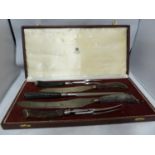 Asprey - a five piece carving set, in fitted case, antler handles.