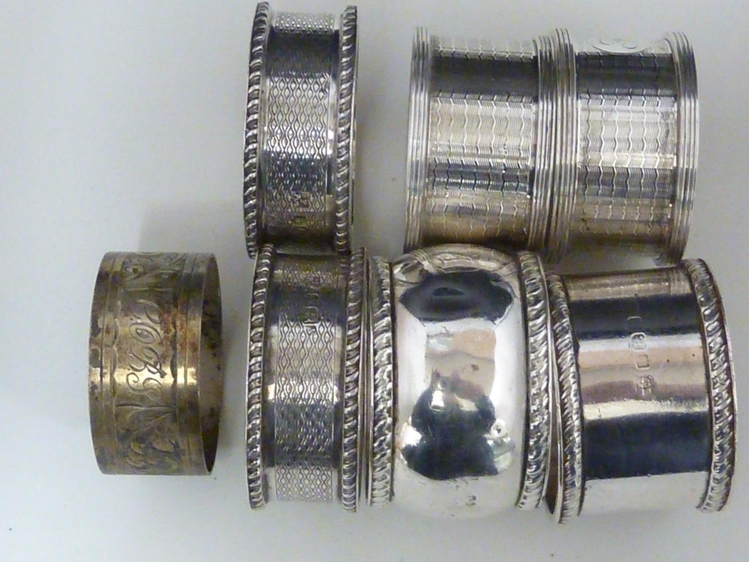 Seven silver napkin rings, including two pairs, various dates and makers, 190 grms approx (7)