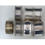 Seven silver napkin rings, including two pairs, various dates and makers, 190 grms approx (7)