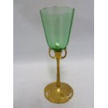 Austrian- a Jugenstil gilded metal and glass wine glass, the ribbed sea green glass bowl on a gilded