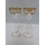 Continental glass - a pair of wine glasses, probably Josephinehutt, the bowls decorated in two