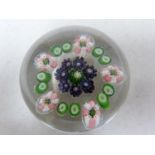 Clichy - a glass paperweight, rose millifiori, the green and pink garland encircling a deep violet