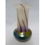 Kralik - an iridescent glass vase, of cylindrical form bulbous to the base, the white body decorated
