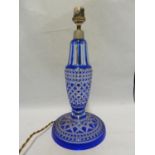 Bohemian- a glass lamp base, of blue overlay cut through to colourless glass with hobnail and