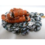 Venetian Glass - Two strings of trade beads, multi-coloured; and red