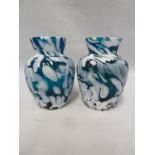 Sowerby - two spatter glass vases, of baluster form the blue glass bodies spattered in white, 11cm