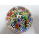 Paul Ysart - a glass paperweight, bright scrambled canes and bubble, 8cm approx