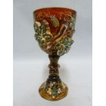 Moser - a signed ruby to amber glass goblet, decorated with a fruiting vine applied in high relief