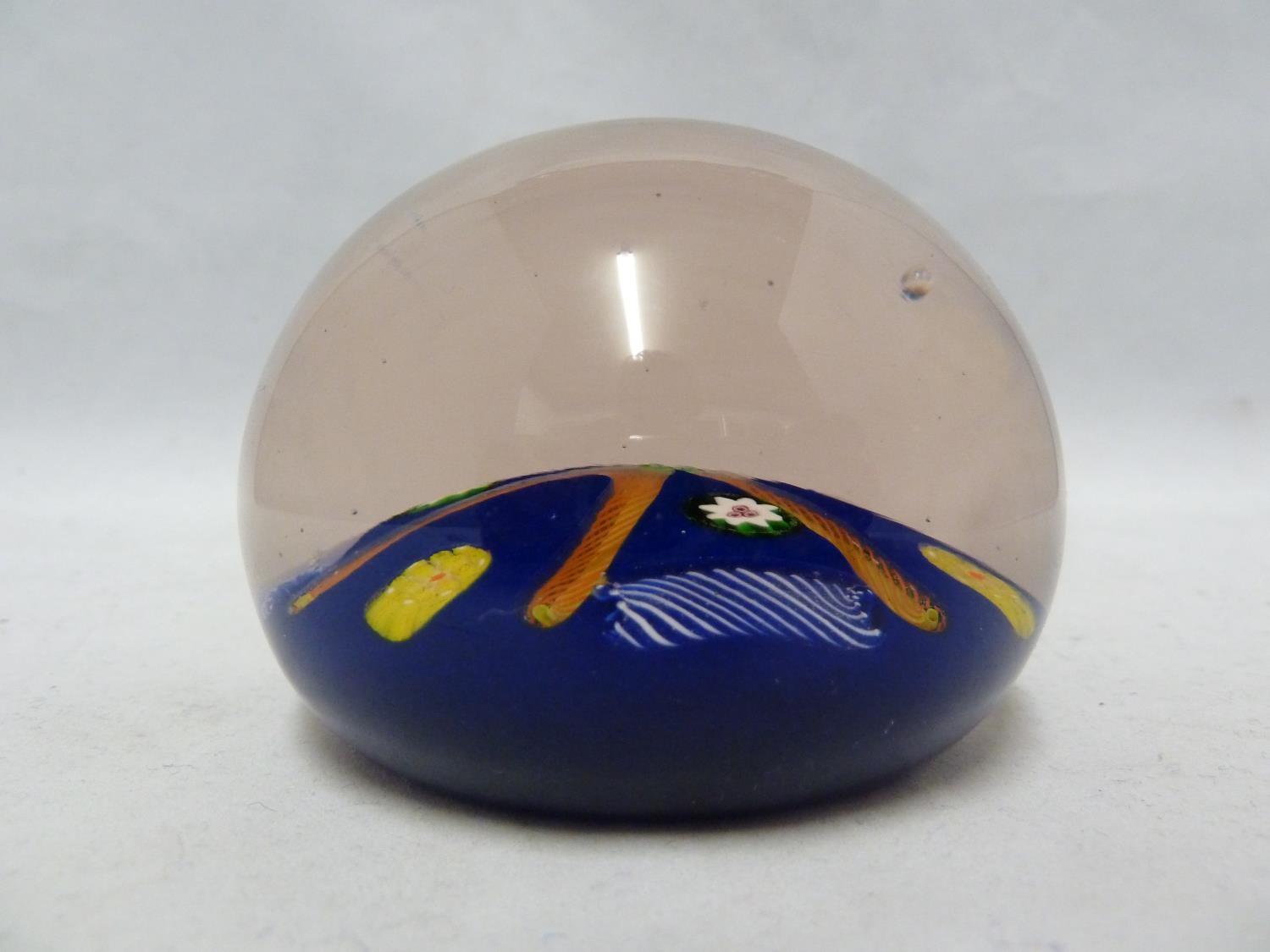 Paul Ysart - a glass paperweight, blue ground, decorated with a star of orange twist canes, 7.5cm - Image 3 of 4