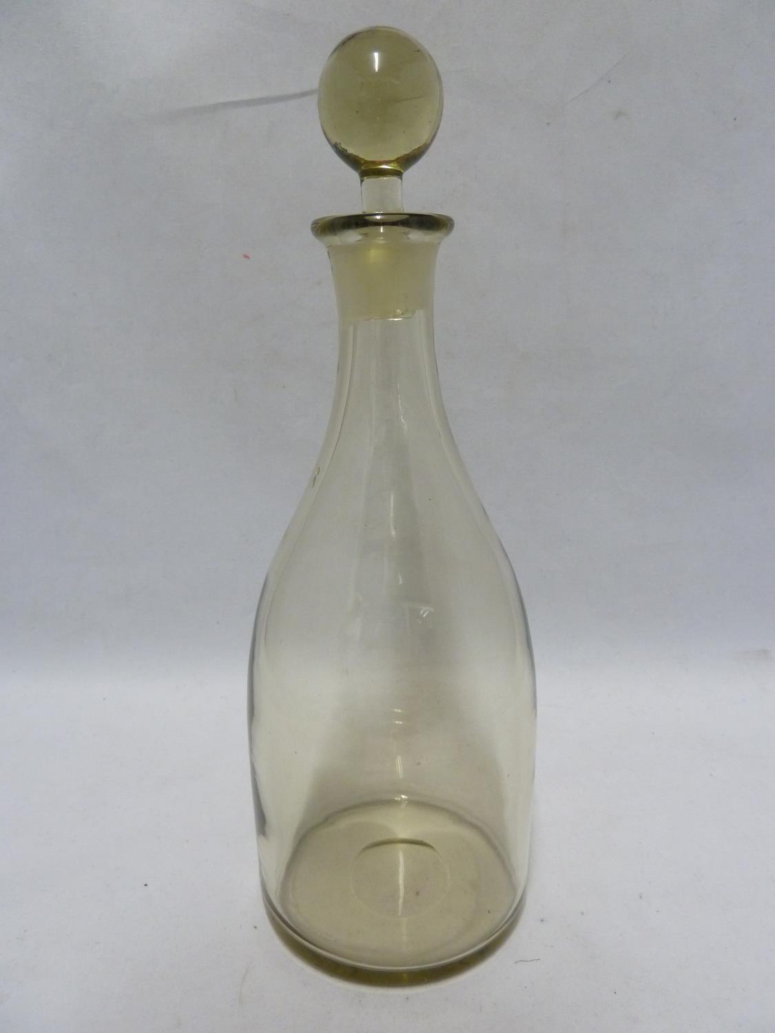 Whitefriars - an olive green decanter and stopper of mallet form beneath stopper with solid ball