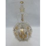 Low Countries - a gilded colourless glass decanter and stopper, of bottle form with vertical