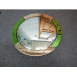 A large Art Deco port-hole glass mirror, circular with convex central plate encircled by mirrored