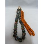Venetian Glass - Two strings of trade beads, multi-coloured; and orange