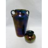 Thomas Webb - Two Bronze glass vases, the deep emerald green body with a purple/gold iridescent