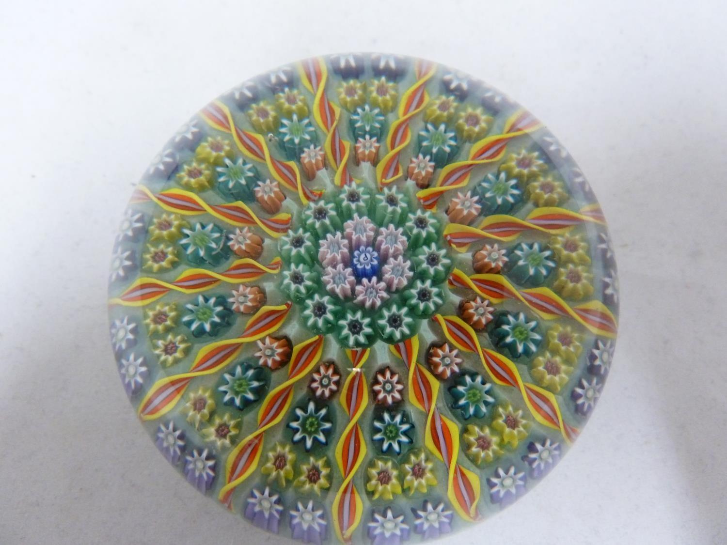 Perthshire - a glass paperweight, concentric millifiori interspersed with candy twist canes, 7.5cm