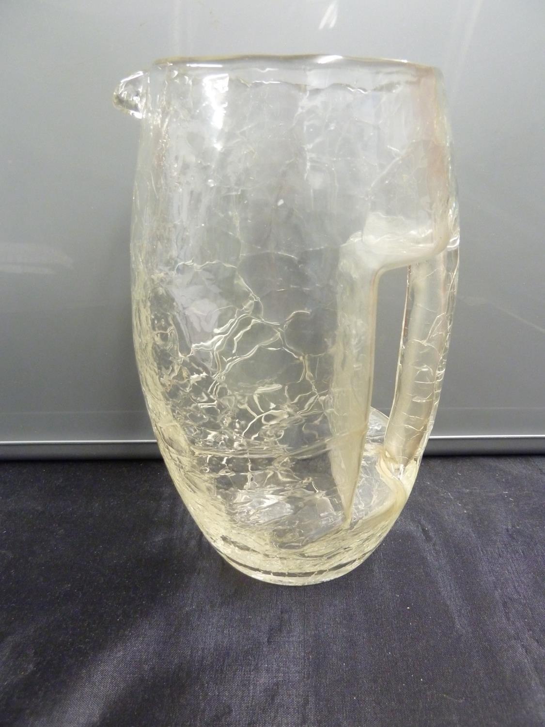 Attributed to Kolomon Moser for Loetz - a colourless cracked ice glass jug, of barrel form with