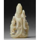 A CHINESE PALE JADE CARVING OG GUANYIN AND A BOY